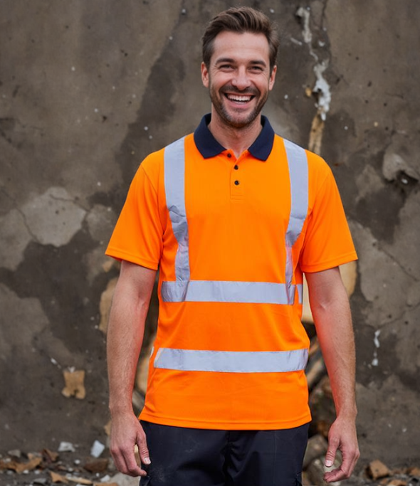 A person wearing a short-sleeved orange hi-vis polo shirt with reflective bands and a contrast ribbed collar.